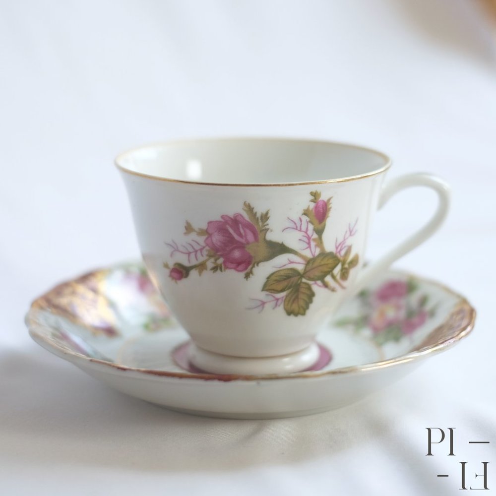 Pink and white floral tea cup and small plate